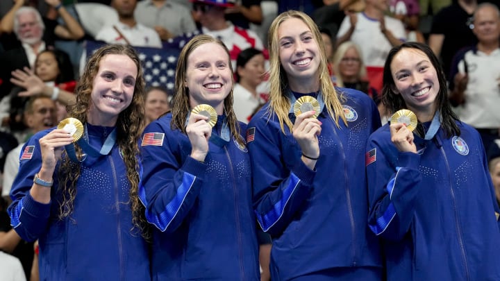 Aug 4, 2024; Nanterre, France; Regan Smith (USA) Lilly King (USA), Gretchen Walsh (USA) and Torri Huske (USA) in the women’s 4 x 100-meter medley relay medal ceremony during the Paris 2024 Olympic Summer Games at Paris La Défense Arena. Mandatory Credit: Grace Hollars-USA TODAY Sports