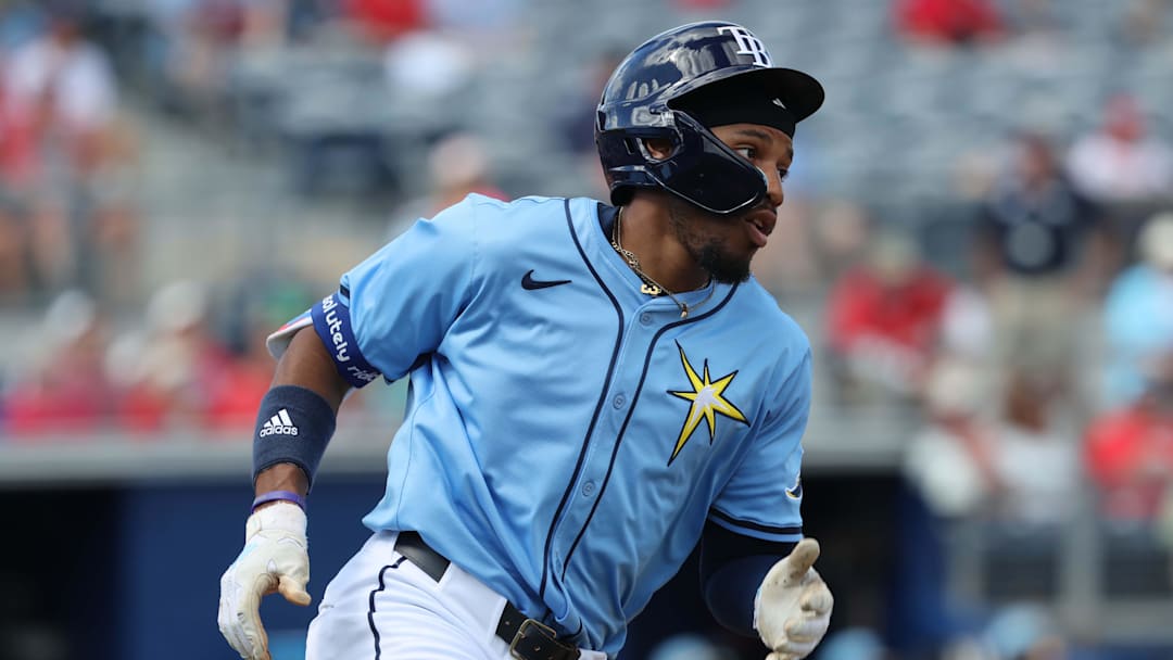 Feb 25, 2025; Port Charlotte, Florida, USA; Tampa Bay Rays outfielder Chandler Simpson (96) singles against the Philadelphia Phillies during the third inning at Charlotte Sports Park. Feb 25, 2025; Port Charlotte, Florida, USA; Tampa Bay Rays outfielder Chandler Simpson (96) singles against the Philadelphia Phillies during the third inning at Charlotte Sports Park.