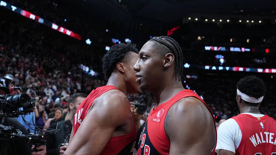 Toronto Raptors forward RJ Barrett hugs Scottie Barnes after scoring the winning basket against the Cavaliers.