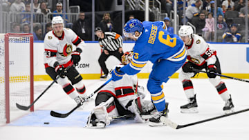 Oct 2, 2025; St. Louis, Missouri, USA; St. Louis Blues defenseman Philip Broberg (6) shoots and scores against Ottawa Senators goaltender Leevi Meriläinen (1) during the second period at Enterprise Center. Mandatory Credit: Jeff Curry-Imagn Images
