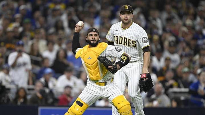 May 18, 2026; San Diego, California, USA; San Diego Padres catcher Rodolfo Duran (48) attempts to throw out Los Angeles Dodgers designated hitter Shohei Ohtani (not pictured) at first base as pitcher Michael King (34) looks on during the sixth inning at Petco Park. Mandatory Credit: Denis Poroy-Imagn Images