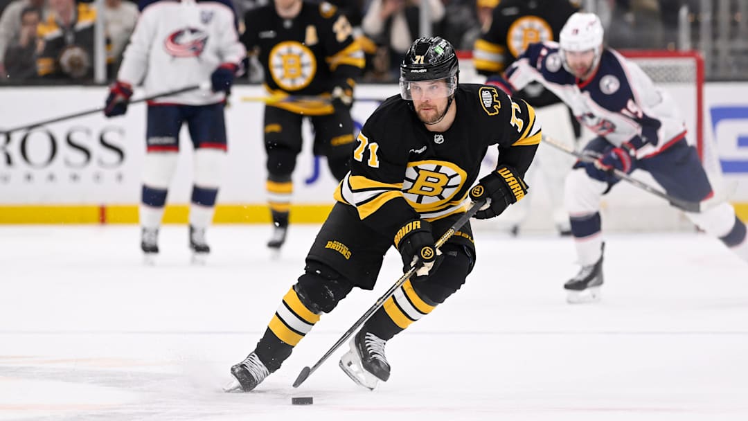 Feb 26, 2026; Boston, Massachusetts, USA; Boston Bruins left wing Viktor Arvidsson (71) skates with the puck towards an empty Columbus Blue Jackets net during the third period at TD Garden. Mandatory Credit: Eric Canha-Imagn Images