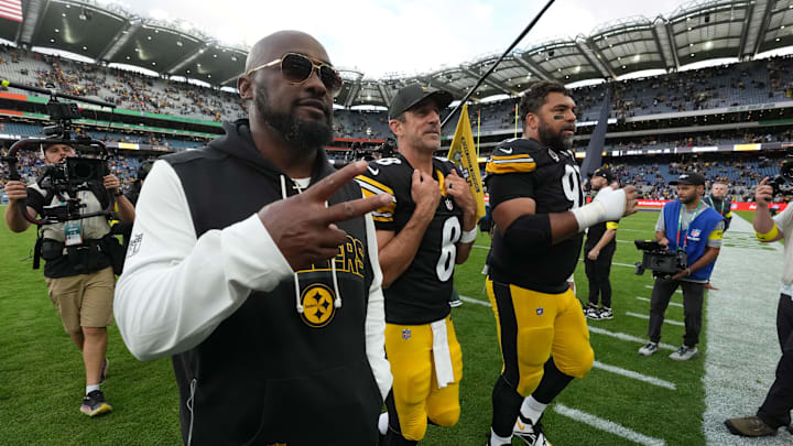 Sep 28, 2025; Dublin, Ireland; Pittsburgh Steelers coach Mike Tomlin (left), quarterback Aaron Rodgers (center) and defensive tackle Cameron Heyward (97) leave the field after an NFL International Series game against the Minnesota Vikings at Croke Park. Mandatory Credit: Kirby Lee-Imagn Images