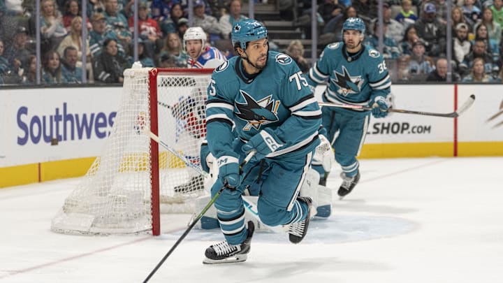 Jan 23, 2026; San Jose, California, USA;  San Jose Sharks right wing Ryan Reaves (75) controls the puck during the third period against the New York Rangers at SAP Center at San Jose. Mandatory Credit: Stan Szeto-Imagn Images