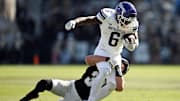 Nov 2, 2024; West Lafayette, Indiana, USA; Northwestern Wildcats running back Joseph Himon II (6) is tackled by Purdue Boilermakers defensive back Dillon Thieneman (31) during the second half at Ross-Ade Stadium. Mandatory Credit: Marc Lebryk-Imagn Images