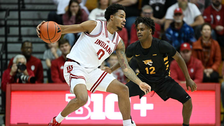 Nov 29, 2025; Bloomington, Indiana, USA; Indiana Hoosiers guard Jasai Miles (0) dribbles the ball against Bethune-Cookman Wildcats guard Dailon Minor (12) during the second half at Simon Skjodt Assembly Hall. Mandatory Credit: Robert Goddin-Imagn Images