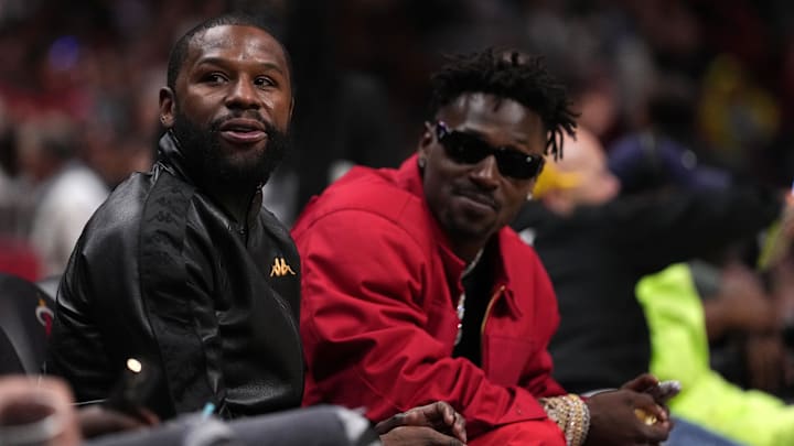 Former boxer Floyd Mayweather Jr. with former NFL player Antonio Brown at an NBA game with the Miami Heat and Brooklyn Nets Former boxer Floyd Mayweather Jr. with former NFL player Antonio Brown at an NBA game with the Miami Heat and Brooklyn Nets