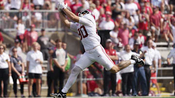 Sep 14, 2024; Madison, Wisconsin, USA;  Alabama Crimson Tide tight end Josh Cuevas (80) catches a pass before scoring a touchdown during the fourth quarter against the Wisconsin Badgers at Camp Randall Stadium. Mandatory Credit: Jeff Hanisch-Imagn Images