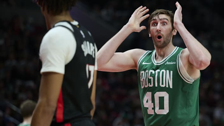 Boston Celtics center Luke Kornet (40) reacts during the second half against to being called for a foul at Moda Center. Man