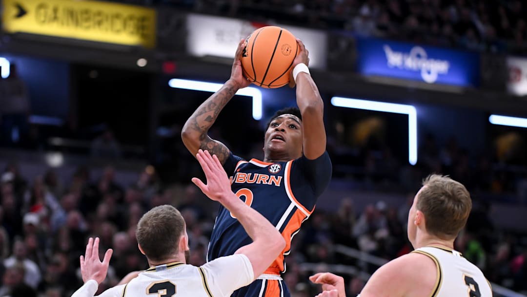 Dec 20, 2025; Indianapolis, Indiana, USA; Auburn Tigers guard Tahaad Pettiford (0) shoots the ball past Purdue Boilermakers guard Braden Smith (3) during the first half at Gainbridge Fieldhouse. Mandatory Credit: Robert Goddin-Imagn Images