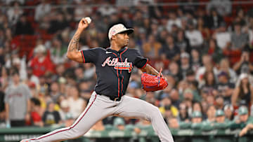 May 16, 2025; Boston, Massachusetts, USA; Atlanta Braves relief pitcher Raisel Iglesias (26) throws against the Boston Red Sox during the ninth inning at Fenway Park. Mandatory Credit: Eric Canha-Imagn Images