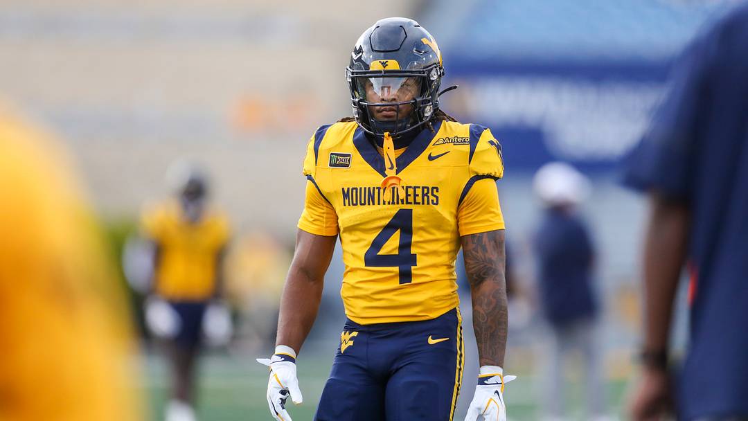 Sep 26, 2026; Morgantown, West Virginia, USA; West Virginia Mountaineers running back Cam Cook (4) warms up prior to their game against the Oklahoma State Cowboys at Milan Puskar Stadium. Mandatory Credit: Ben Queen-Imagn Images