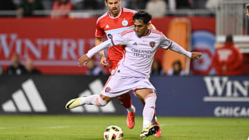 May 29, 2024; Chicago, Illinois, USA;  Orlando City SC midfielder Facundo Torres (10) controls the ball in front of Chicago Fire FC midfielder Gaston Gimenez (30) in the second half at Soldier Field. Mandatory Credit: Jamie Sabau-USA TODAY Sports