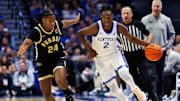 Oct 24, 2025; Lexington, KY, USA; Kentucky Wildcats guard Jasper Johnson (2) brings the ball up court against Purdue Boilermakers guard Gicarri Harris (24) during the second half at Rupp Arena at Central Bank Center. 
