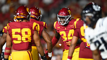 Sep 7, 2024; Los Angeles, California, USA; USC Trojans defensive end Braylan Shelby (34) celebrates after Utah State Aggies quarterback Bryson Barnes (16) (not pictured) is sacked during the third quarter at United Airlines Field at Los Angeles Memorial Coliseum. Mandatory Credit: Jonathan Hui-Imagn Images