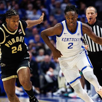Oct 24, 2025; Lexington, KY, USA; Kentucky Wildcats guard Jasper Johnson (2) brings the ball up court against Purdue Boilermakers guard Gicarri Harris (24) during the second half at Rupp Arena at Central Bank Center. 