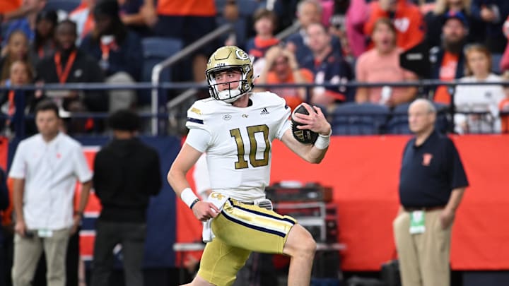 Sep 7, 2024; Syracuse, New York, USA; Georgia Tech Yellow Jackets quarterback Haynes King (10) runs for a touchdown against the Syracuse Orange in the first quarter at JMA Wireless Dome. Mandatory Credit: Mark Konezny-Imagn Images