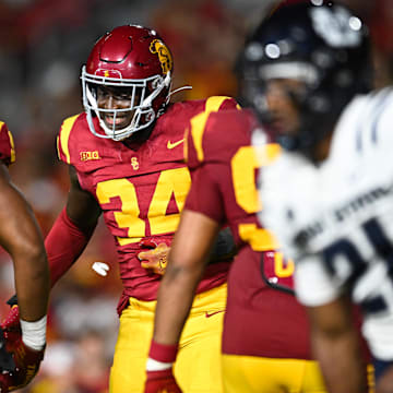 Sep 7, 2024; Los Angeles, California, USA; USC Trojans defensive end Braylan Shelby (34) celebrates after Utah State Aggies quarterback Bryson Barnes (16) (not pictured) is sacked during the third quarter at United Airlines Field at Los Angeles Memorial Coliseum.