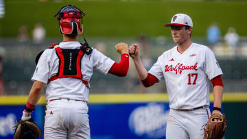 May 23, 2024; Charlotte, NC, USA; NC State Wolfpack pitcher Sam HIghfill (17) celebrates with catcher Jacob Cozart (14) after closing out the top of the third inning against the Duke Blue Devils during the ACC Baseball Tournament at Truist Field. Mandatory Credit: Scott Kinser-USA TODAY Sports