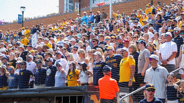 Jun 5, 2026; Morgantown, WV, USA; West Virginia Mountaineers fans sing “Country Roads” after defeating the Cal Poly Mustangs at Kendrick Family Ballpark. Mandatory Credit: Ben Queen-Imagn Images