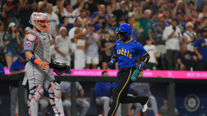 Seattle Mariners center fielder Victor Robles (10) scores a run against the New York Mets during the seventh inning at T-Mobile Park on Aug 9.