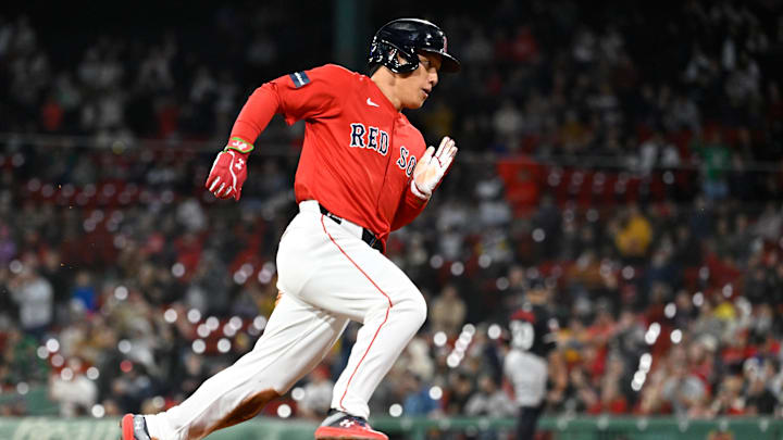 Sep 22, 2024; Boston, MA, USA; Boston Red Sox designated hitter Masataka Yoshida (7) scores on an RBI by catcher Connor Wong (12) (not pictured) during the sixth inning against the Minnesota Twins at Fenway Park. Mandatory Credit: Eric Canha-Imagn Images Sep 22, 2024; Boston, MA, USA; Boston Red Sox designated hitter Masataka Yoshida (7) scores on an RBI by catcher Connor Wong (12) (not pictured) during the sixth inning against the Minnesota Twins at Fenway Park. Mandatory Credit: Eric Canha-Imagn Images