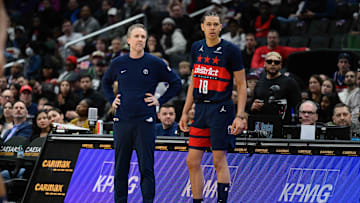 Mar 5, 2025; Washington, District of Columbia, USA; Washington Wizards head coach Brian Keefe looks on with forward Kyshawn George (18) during the fourth quarter against the Utah Jazz at Capital One Arena. Mandatory Credit: Reggie Hildred-Imagn Images