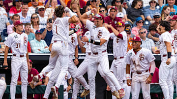 Jun 19, 2024; Omaha, NE, USA; Florida State Seminoles shortstop Alex Lodise (1) celebrates with teammates after hitting a home run against the Tennessee Volunteers during the seventh inning at Charles Schwab Field Omaha. Mandatory Credit: Dylan Widger-Imagn Images