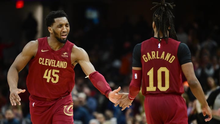 Feb 14, 2024; Cleveland, Ohio, USA; Cleveland Cavaliers guard Donovan Mitchell (45) celebrates with guard Darius Garland (10) during the second half against the Chicago Bulls at Rocket Mortgage FieldHouse. Mandatory Credit: Ken Blaze-USA TODAY Sports