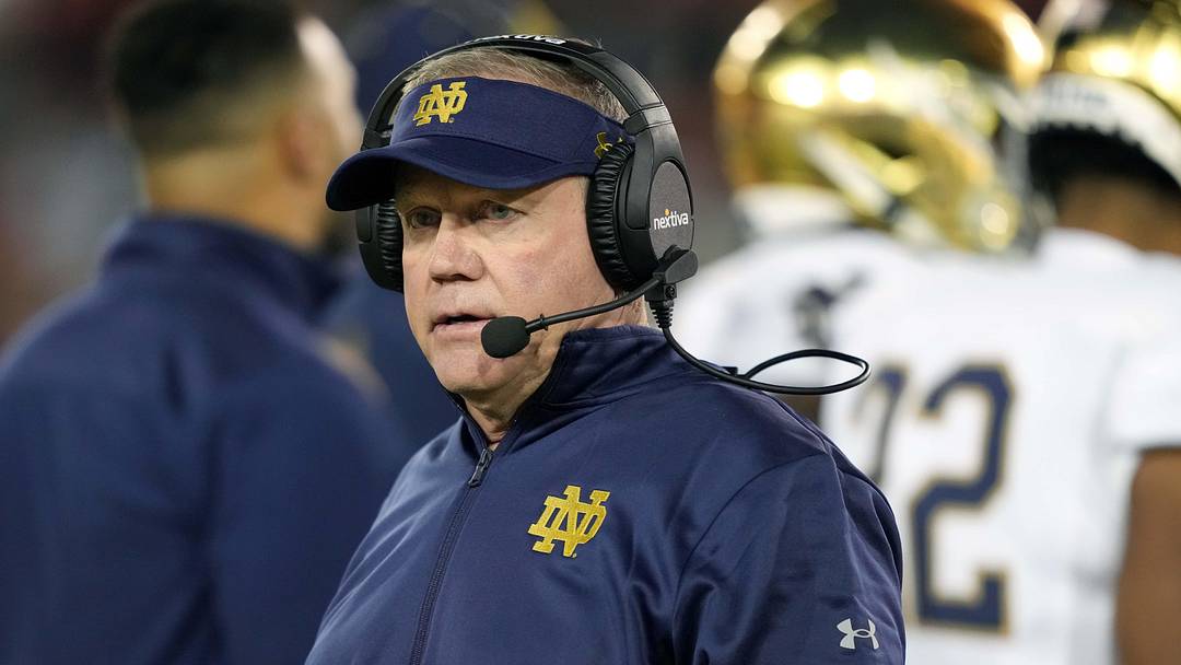 Nov 27, 2021; Stanford, California, USA; Notre Dame Fighting Irish head coach Brian Kelly walks on the field during the second quarter against the Stanford Cardinal at Stanford Stadium. Mandatory Credit: Darren Yamashita-Imagn Images Nov 27, 2021; Stanford, California, USA; Notre Dame Fighting Irish head coach Brian Kelly walks on the field during the second quarter against the Stanford Cardinal at Stanford Stadium. Mandatory Credit: Darren Yamashita-Imagn Images