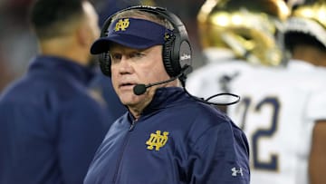 Nov 27, 2021; Stanford, California, USA; Notre Dame Fighting Irish head coach Brian Kelly walks on the field during the second quarter against the Stanford Cardinal at Stanford Stadium. 