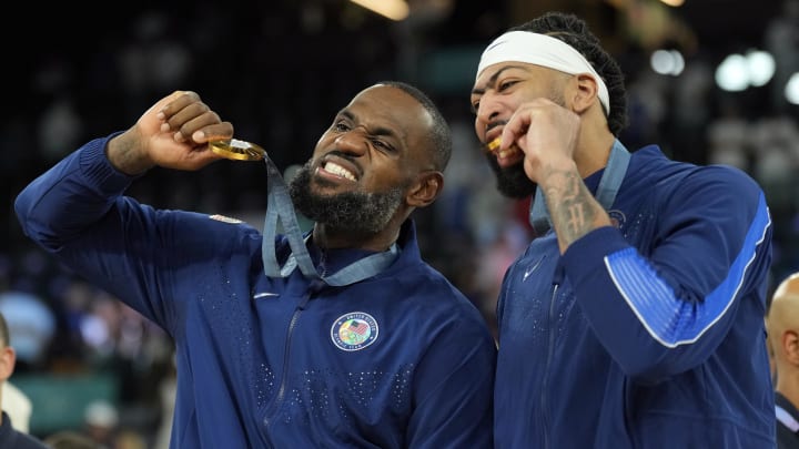 Aug 10, 2024; Paris, France; United States forward LeBron James (6) and center Anthony Davis (14) celebrate after defeating France in the men's basketball gold medal game during the Paris 2024 Olympic Summer Games at Accor Arena. Mandatory Credit: Kyle Terada-USA TODAY Sports