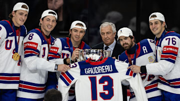 Switzerland v USA - 2025 IIHF Ice Hockey World Championship Final, Clayton Keller, Zach Werenski, Conor Garland, Tage Thompson, Brady Skjei all with the World Championship trophy, while holding  the late Johnny Gaudreau's team USA jersey