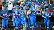 Jun 14, 2025; Omaha, Neb, USA;  UCLA Bruins pitcher Easton Hawk (27) celebrates with catcher Cashel Dugger (40) after the win against the Murray State Racers at Charles Schwab Field. Mandatory Credit: Steven Branscombe-Imagn Images