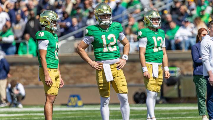 Apr 12, 2025; Notre Dame, IN, USA; Notre Dame Fighting Irish quarterback Kenny Minchey (8), Notre Dame Fighting Irish quarterback Blake Hebert (12), Notre Dame Fighting Irish quarterback CJ Carr (13) watch during the Blue-Gold game at Notre Dame Stadium. Mandatory Credit: Michael Caterina-Imagn Images