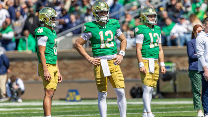 Apr 12, 2025; Notre Dame, IN, USA; Notre Dame Fighting Irish quarterback Kenny Minchey (8), Notre Dame Fighting Irish quarterback Blake Hebert (12), Notre Dame Fighting Irish quarterback CJ Carr (13) watch during the Blue-Gold game at Notre Dame Stadium. Mandatory Credit: Michael Caterina-Imagn Images