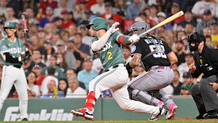 Aug 15, 2025; Boston, Massachusetts, USA; Boston Red Sox third baseman Alex Bregman (2) hits a one-run RBI double to tie the game during the sixth inning against the Miami Marlins at Fenway Park. Mandatory Credit: Eric Canha-Imagn Images