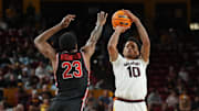 Feb 18, 2025; Tempe, Arizona, USA; Arizona State Sun Devils guard BJ Freeman (10) shoots over Houston Cougars guard Terrance Arceneaux (23) during the second half at Desert Financial Arena. Mandatory Credit: Joe Camporeale-Imagn Images