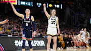 Apr 5, 2024; Cleveland, OH, USA; Iowa Hawkeyes guard Caitlin Clark (22) and Connecticut Huskies guard Paige Bueckers (5) react in the second quarter in the semifinals of the Final Four of the womens 2024 NCAA Tournament at Rocket Mortgage FieldHouse. Mandatory Credit: Kirby Lee-Imagn Images