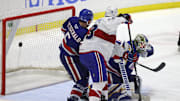 Amerks goalie Aaron Dell is pressure near the crease on this game winning goal by Laval  s Jean-Sebastien Dea int the 3rd overtime.  The Rockets win the North Division Finals 3 games to none.