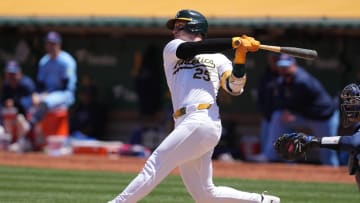 Jun 9, 2024; Oakland, California, USA; Oakland Athletics designated hitter Brent Rooker (25) hits a home run against the Toronto Blue Jays during the sixth inning at Oakland-Alameda County Coliseum. Mandatory Credit: Darren Yamashita-USA TODAY Sports