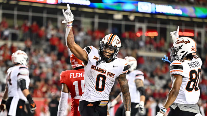 Nov 18, 2023; Houston, Texas, USA; Oklahoma State Cowboys wide receiver Rashod Owens (10) reacts after his touchdown during the fourth quarter against the Houston Cougars at TDECU Stadium. Mandatory Credit: Maria Lysaker-USA TODAY Sports