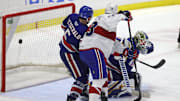 Amerks goalie Aaron Dell is pressure near the crease on this game winning goal by Laval  s Jean-Sebastien Dea int the 3rd overtime.  The Rockets win the North Division Finals 3 games to none.