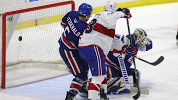 Amerks goalie Aaron Dell is pressure near the crease on this game winning goal by Laval  s Jean-Sebastien Dea int the 3rd overtime.  The Rockets win the North Division Finals 3 games to none.