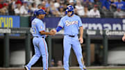 Aug 24, 2025; Arlington, Texas, USA; Texas Rangers third base coach Tony Beasley (27) and center fielder Wyatt Langford (36) tap fists after Langford steals third base during the first inning against the Cleveland Guardians at Globe Life Field. 