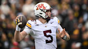 Oct 25, 2025; Iowa City, Iowa, USA; Minnesota Golden Gophers quarterback Drake Lindsey (5) throws a pass against the Iowa Hawkeyes during the first quarter at Kinnick Stadium. Mandatory Credit: Jeffrey Becker-Imagn Images