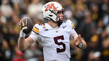 Oct 25, 2025; Iowa City, Iowa, USA; Minnesota Golden Gophers quarterback Drake Lindsey (5) throws a pass against the Iowa Hawkeyes during the first quarter at Kinnick Stadium. Mandatory Credit: Jeffrey Becker-Imagn Images