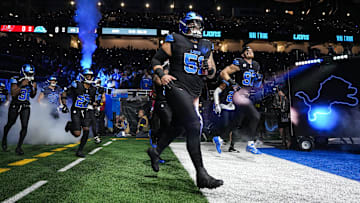 Detroit Lions defensive tackle Roy Lopez (51) and defensive end Aidan Hutchinson (97) run onto the field for the first half against the Tampa Bay Buccaneers at Ford Field in Detroit on Monday, Oct. 20, 2025.