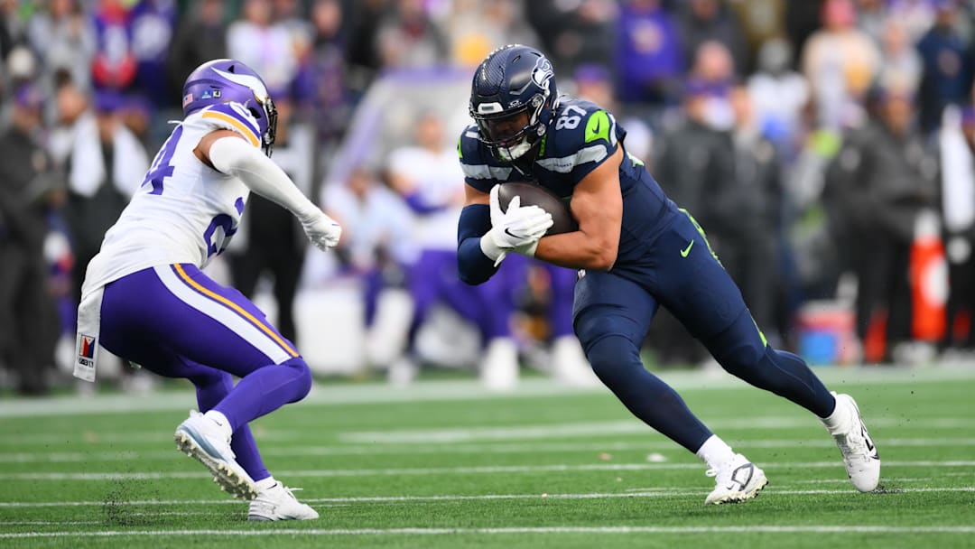Dec 22, 2024; Seattle, Washington, USA; Seattle Seahawks tight end Noah Fant (87) carries the ball after a catch against the Minnesota Vikings during the second half at Lumen Field. Mandatory Credit: Steven Bisig-Imagn Images
