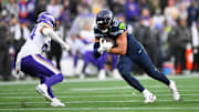 Dec 22, 2024; Seattle, Washington, USA; Seattle Seahawks tight end Noah Fant (87) carries the ball after a catch against the Minnesota Vikings during the second half at Lumen Field. Mandatory Credit: Steven Bisig-Imagn Images